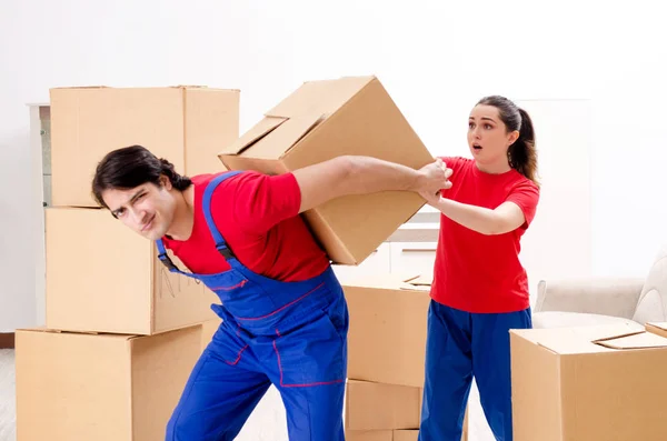 depositphotos_250174796-stock-photo-professional-movers-doing-home-relocation